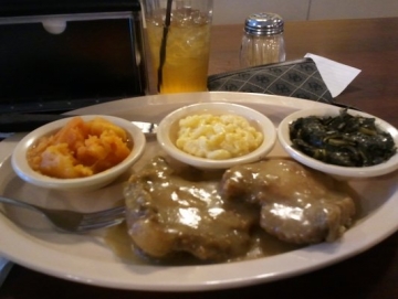 Busy Bees - Smothered Pork Chops, Candied Yams, Mac & Chz, Greens | Image Credit: Yelp; Alexis J.